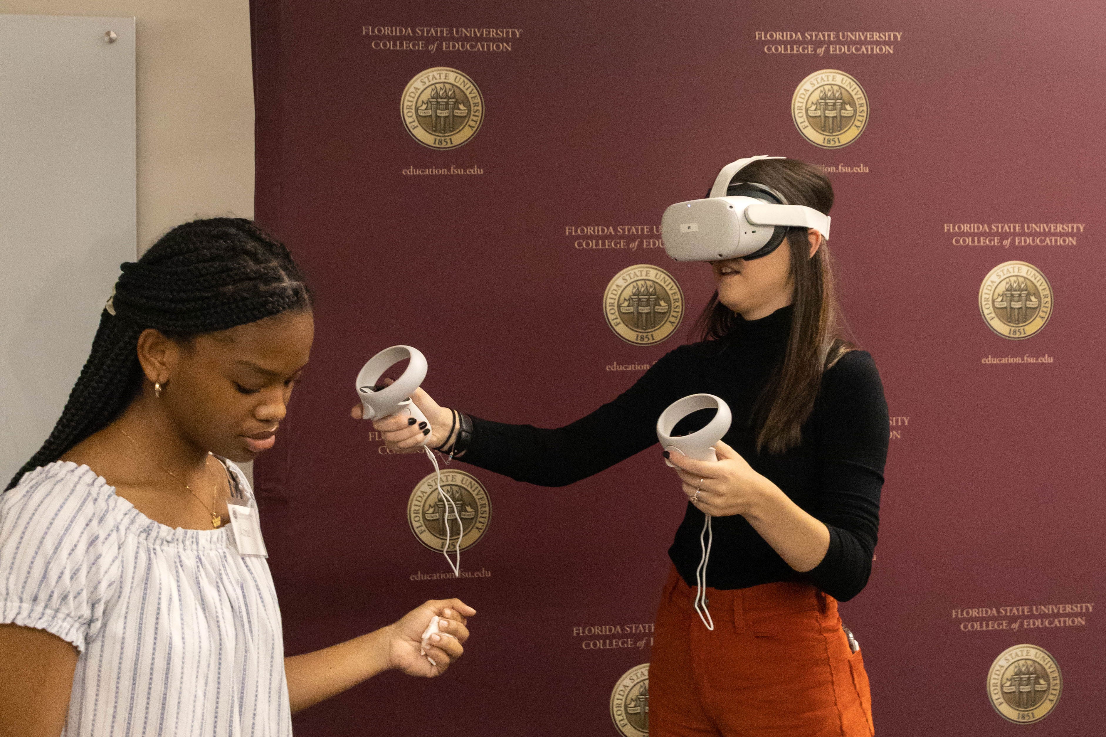 Two females testing out new technologies.