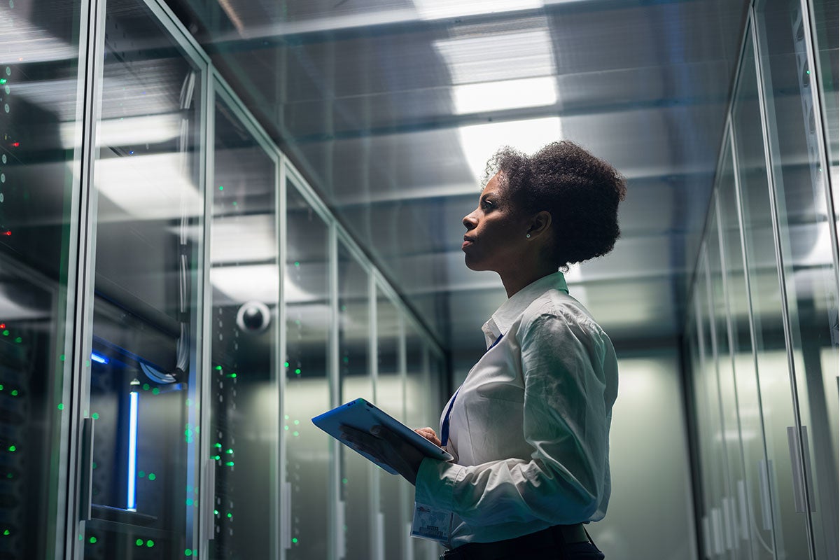 A female staff member checking the servers.