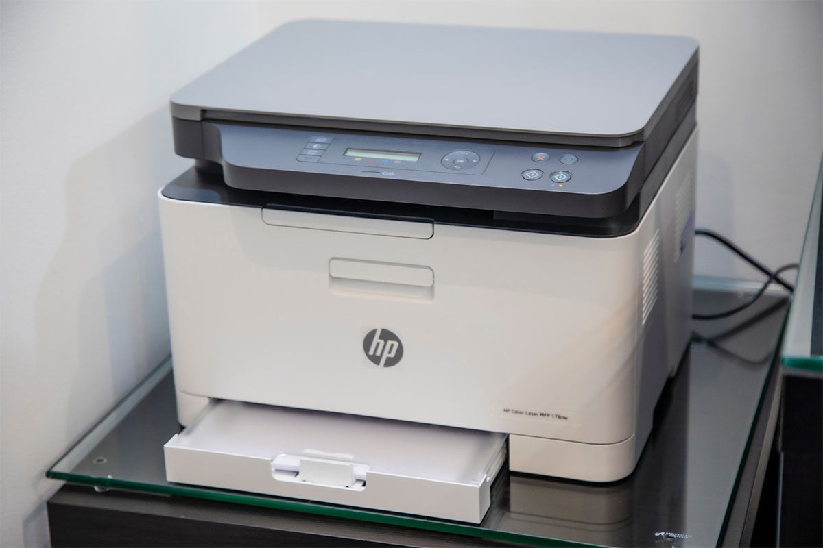 A printer sitting on a desk.